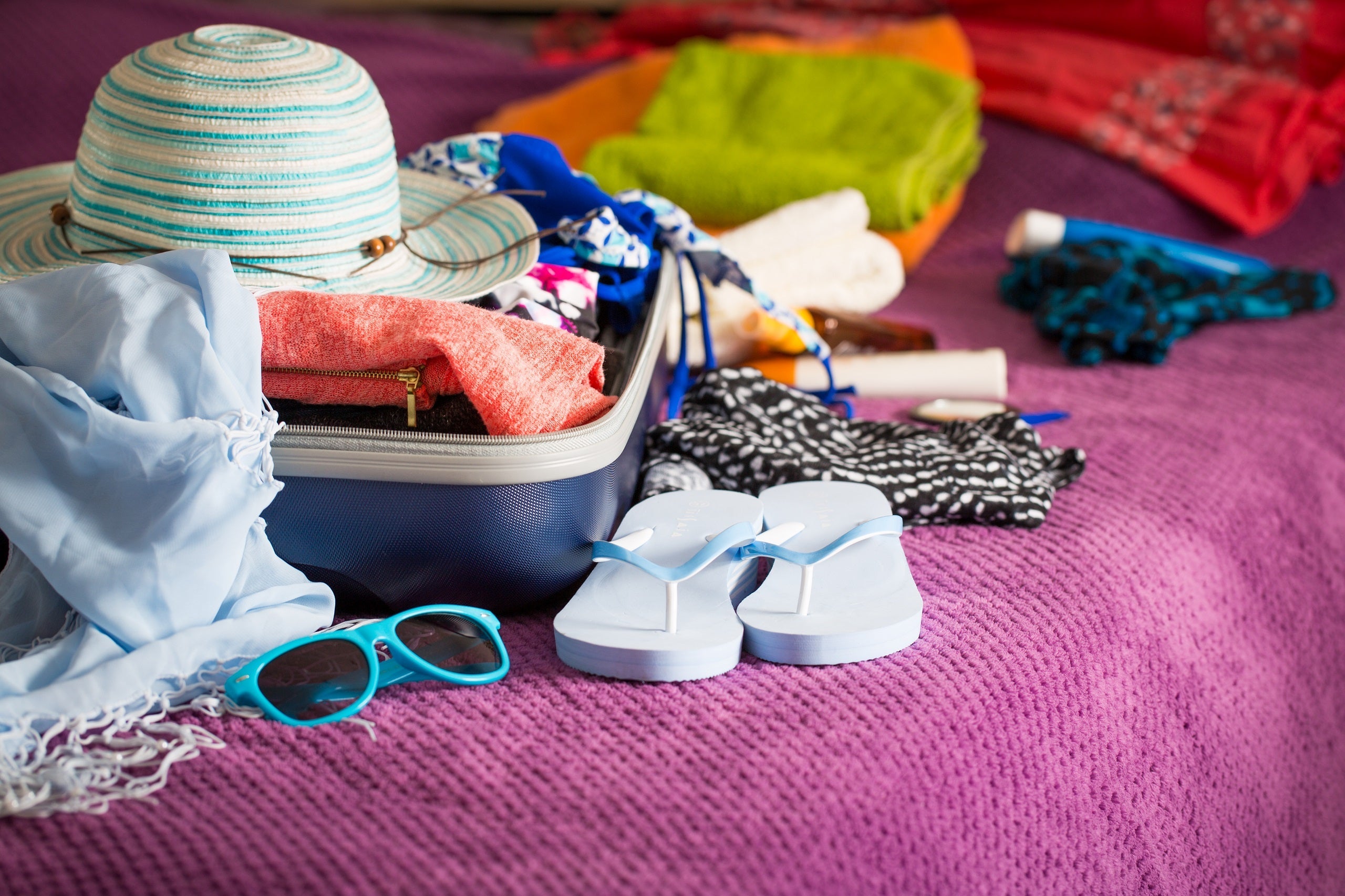 Open suitcase on bed