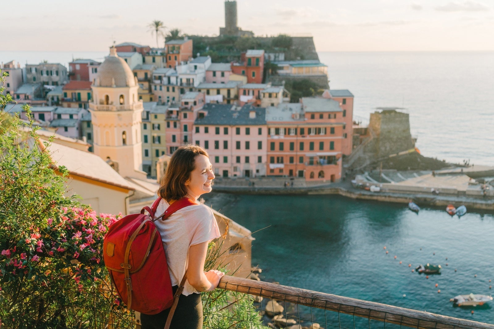 Woman looking at scenic view of Cinque Terre village in Italy