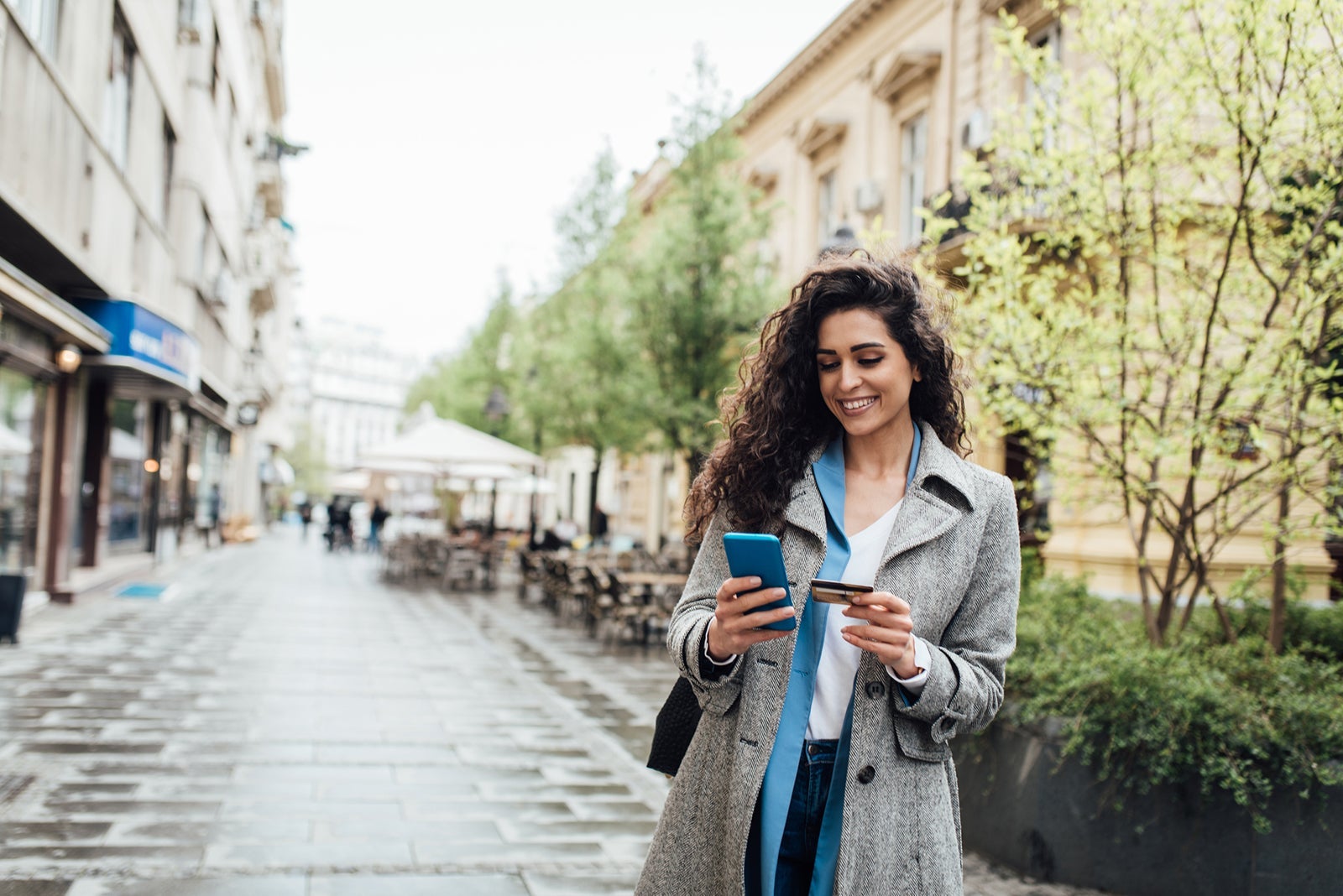 Portrait of a beautiful businesswoman banking online on the move