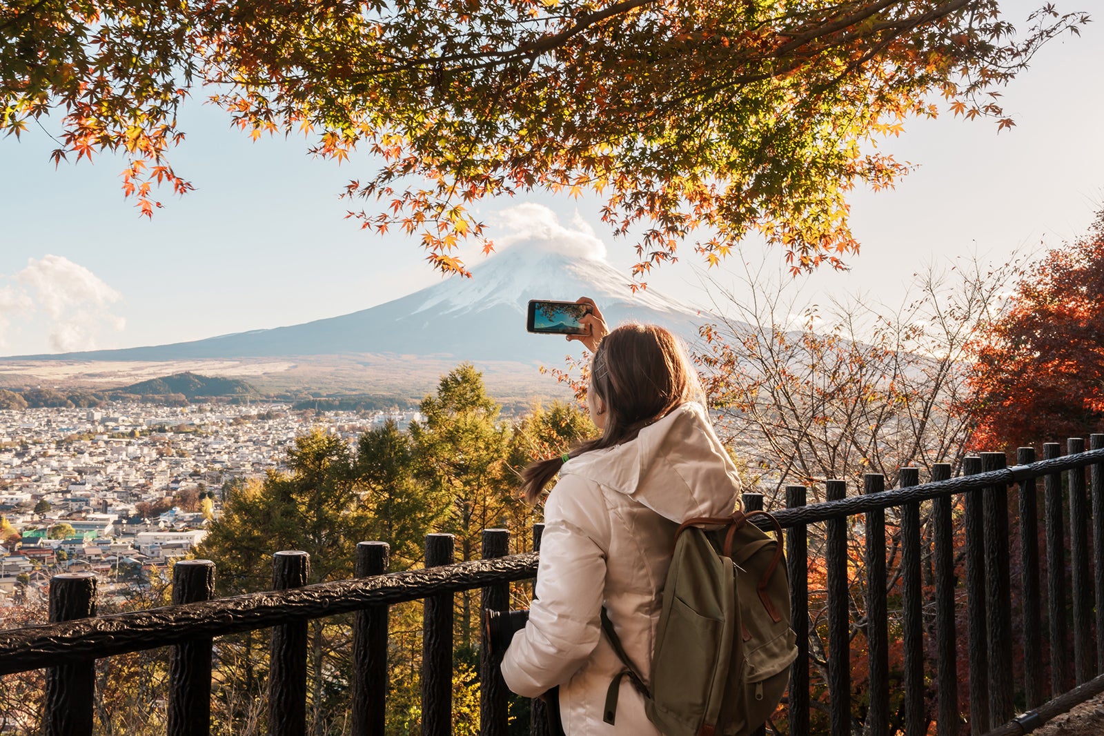 Woman tourist with mount Fuji at Chureito Pagoda in Autumn season, Traveler travel Arakurayama Sengen Park, Yamanashi, Japan. Landmark for tourist attraction. Japan Travel, Destination and Vacation